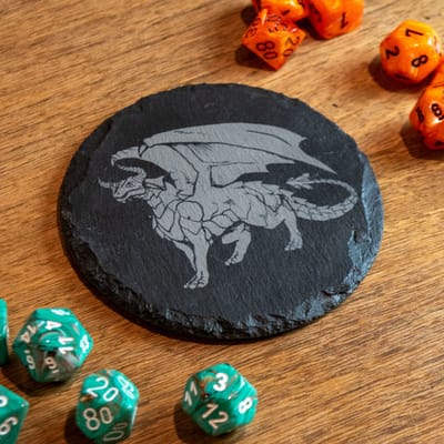 Slate coaster engraved with a dragon